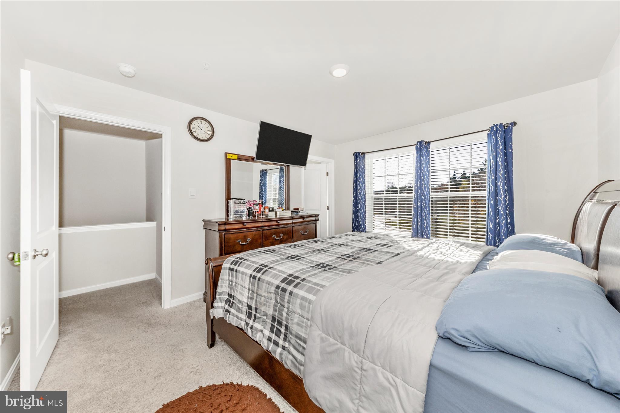 8648 Walter Martz Road Frederick, MD 21702 - Photo 24 of 50 a bedroom with a bed and wooden floor