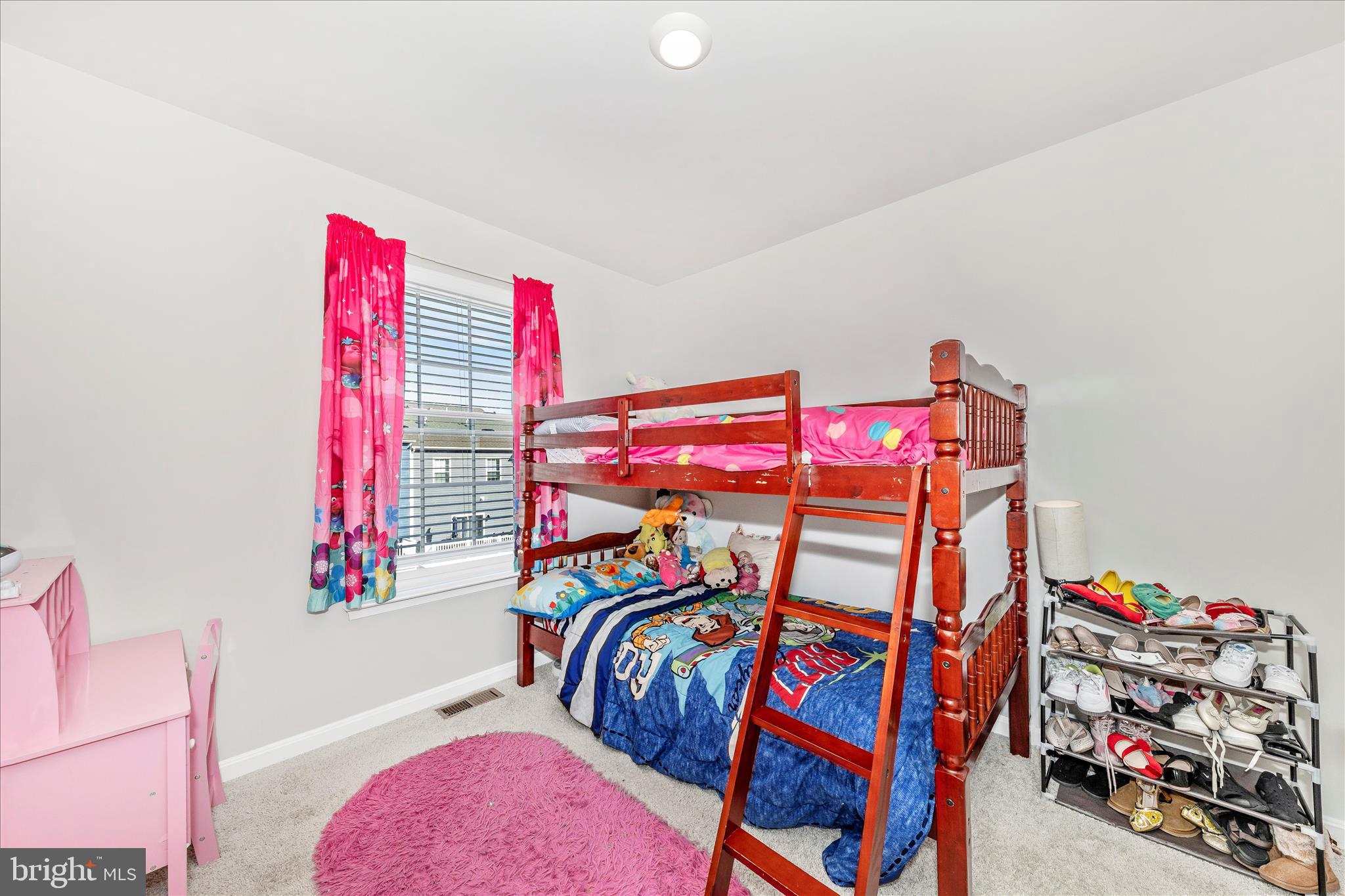 8648 Walter Martz Road Frederick, MD 21702 - Photo 30 of 50 a view of a bedroom with clothes shoes and a chandelier