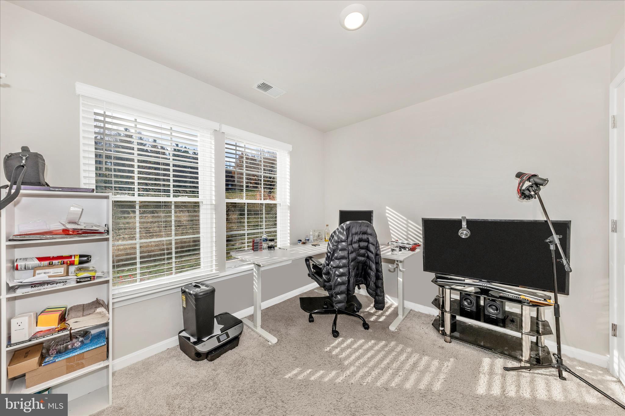 8648 Walter Martz Road Frederick, MD 21702 - Photo 3 of 50 a living room with furniture a flat screen tv and a window