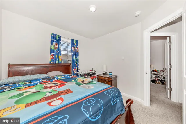 a bedroom with a bed and a table in it