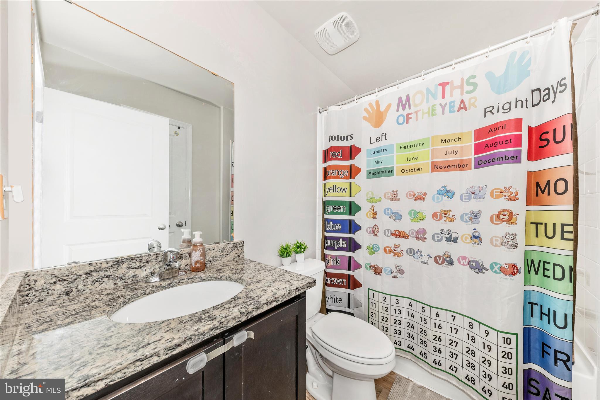 8648 Walter Martz Road Frederick, MD 21702 - Photo 36 of 50 a bathroom with a granite countertop sink and a mirror