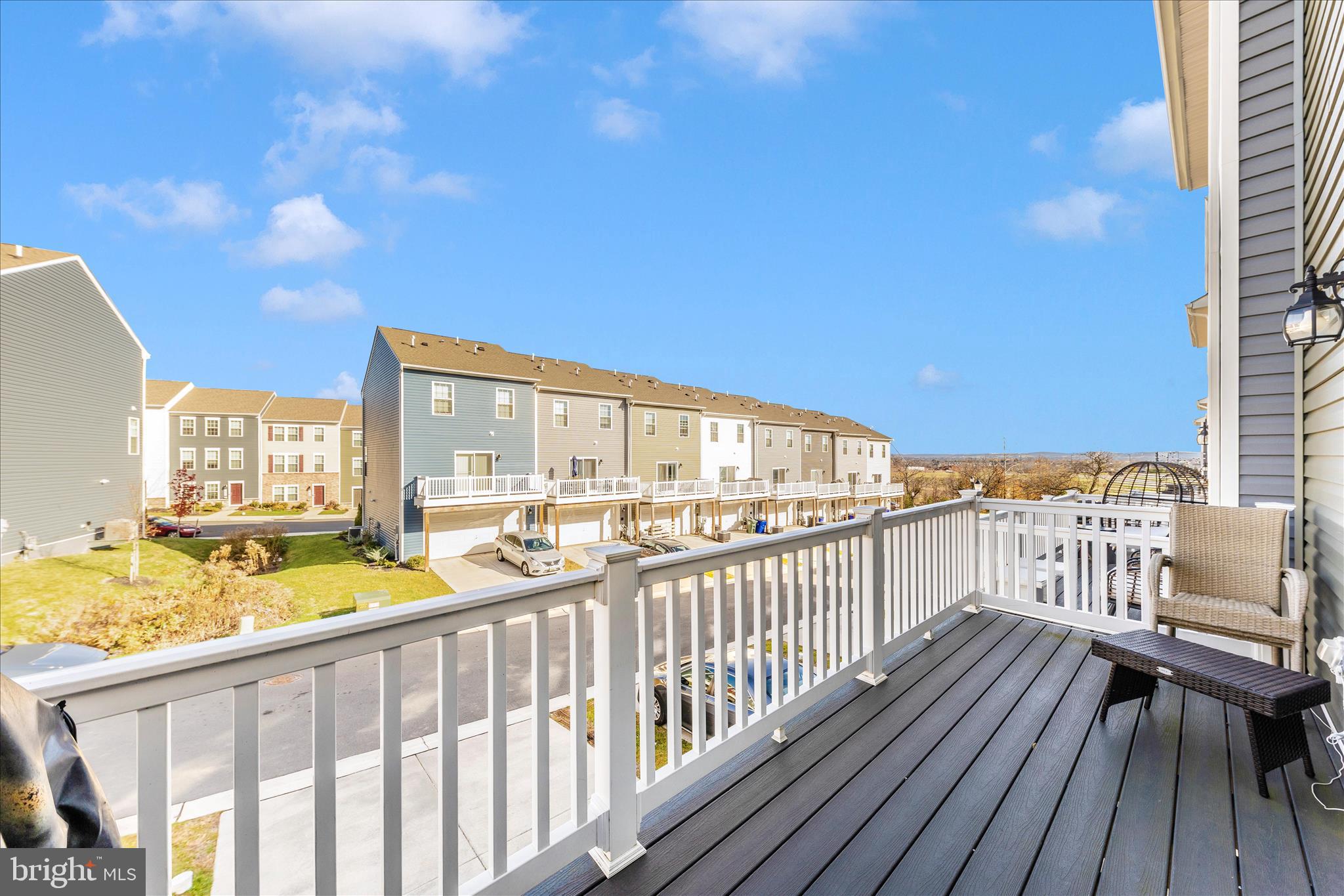 8648 Walter Martz Road Frederick, MD 21702 - Photo 44 of 50 a view of a balcony with wooden floor and outdoor seating