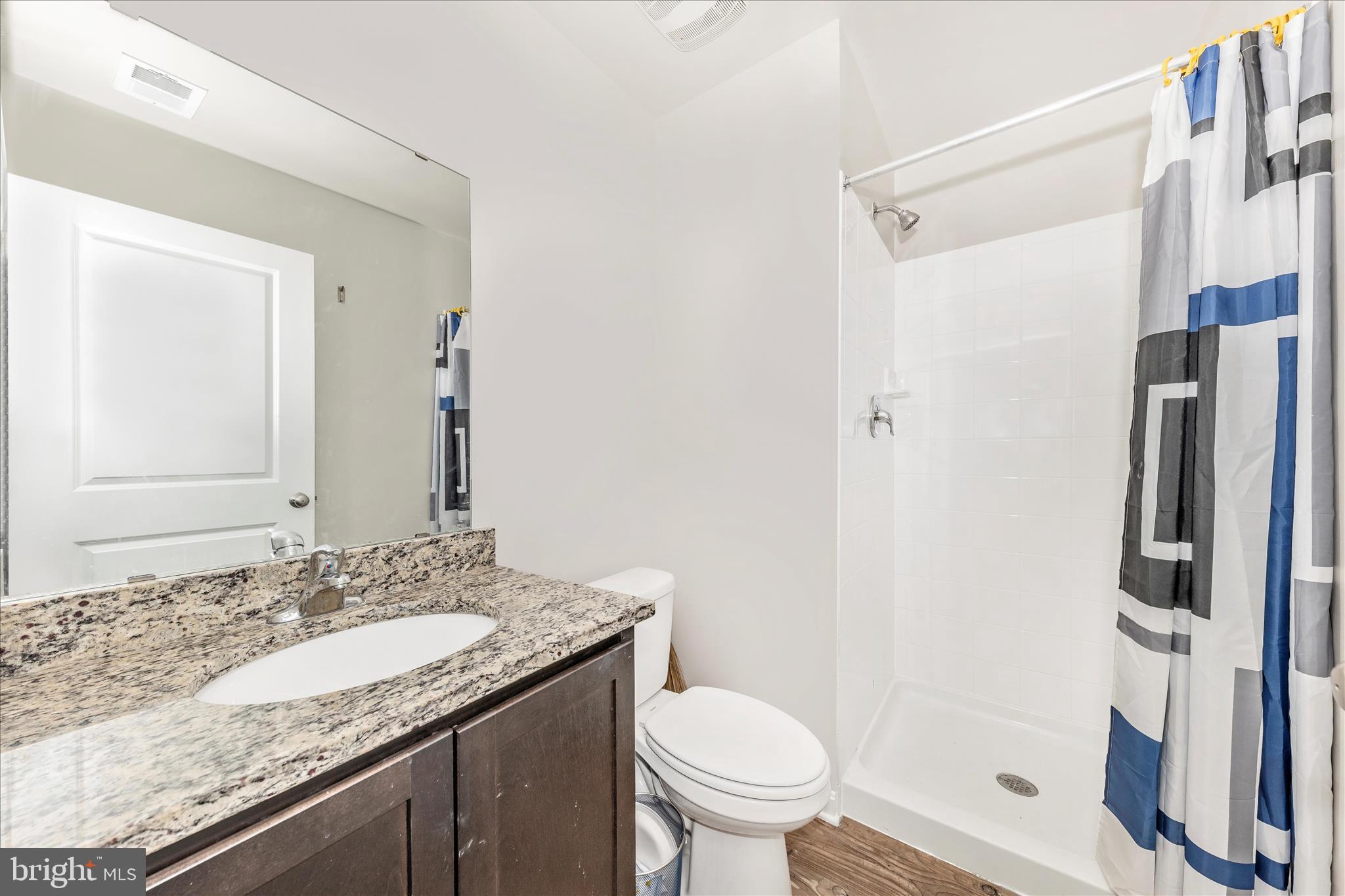 8648 Walter Martz Road Frederick, MD 21702 - Photo 6 of 50 a bathroom with a granite countertop sink toilet and shower