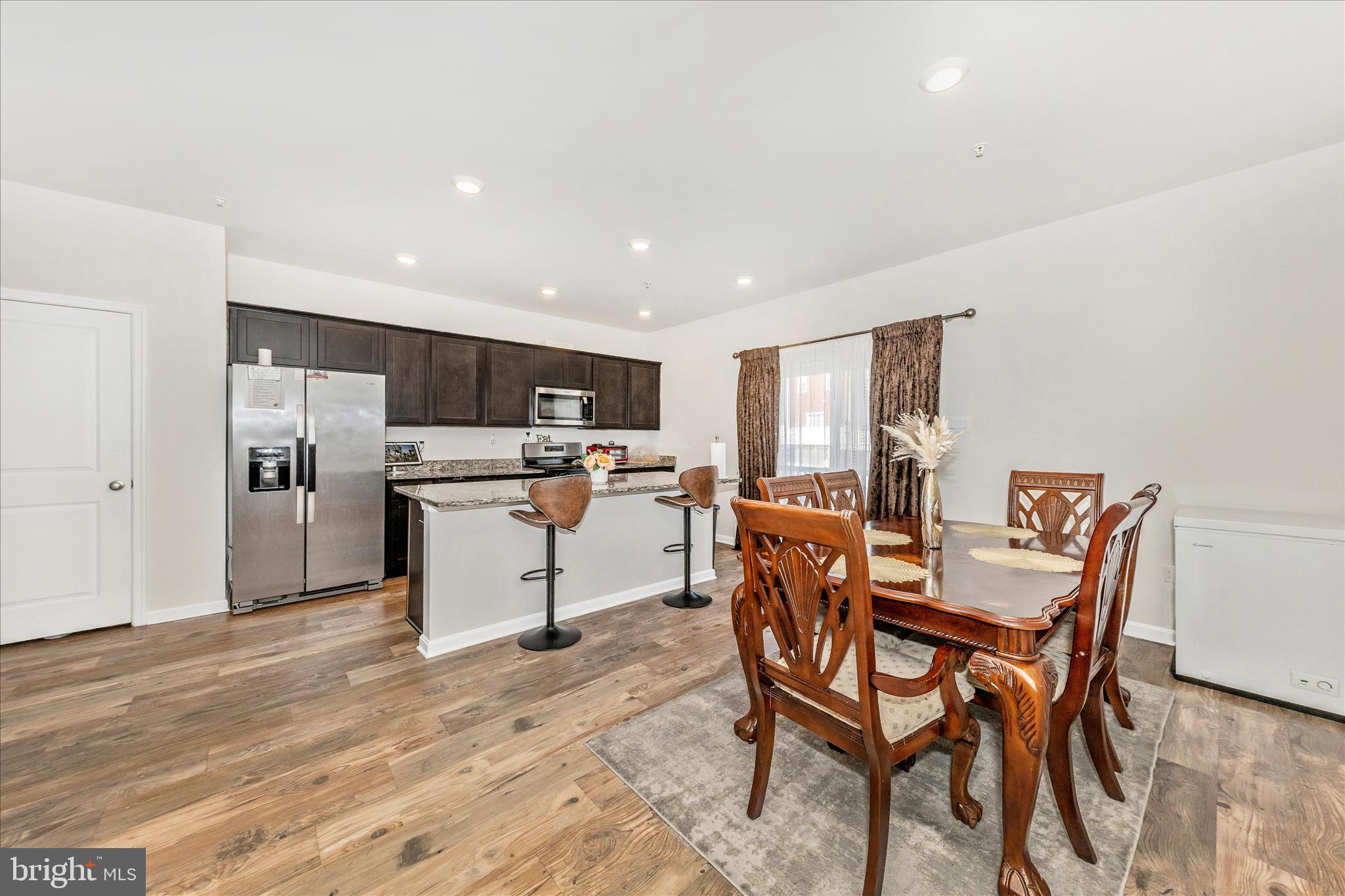 8648 Walter Martz Road Frederick, MD 21702 - Photo 8 of 50 a dining room with furniture and kitchen view