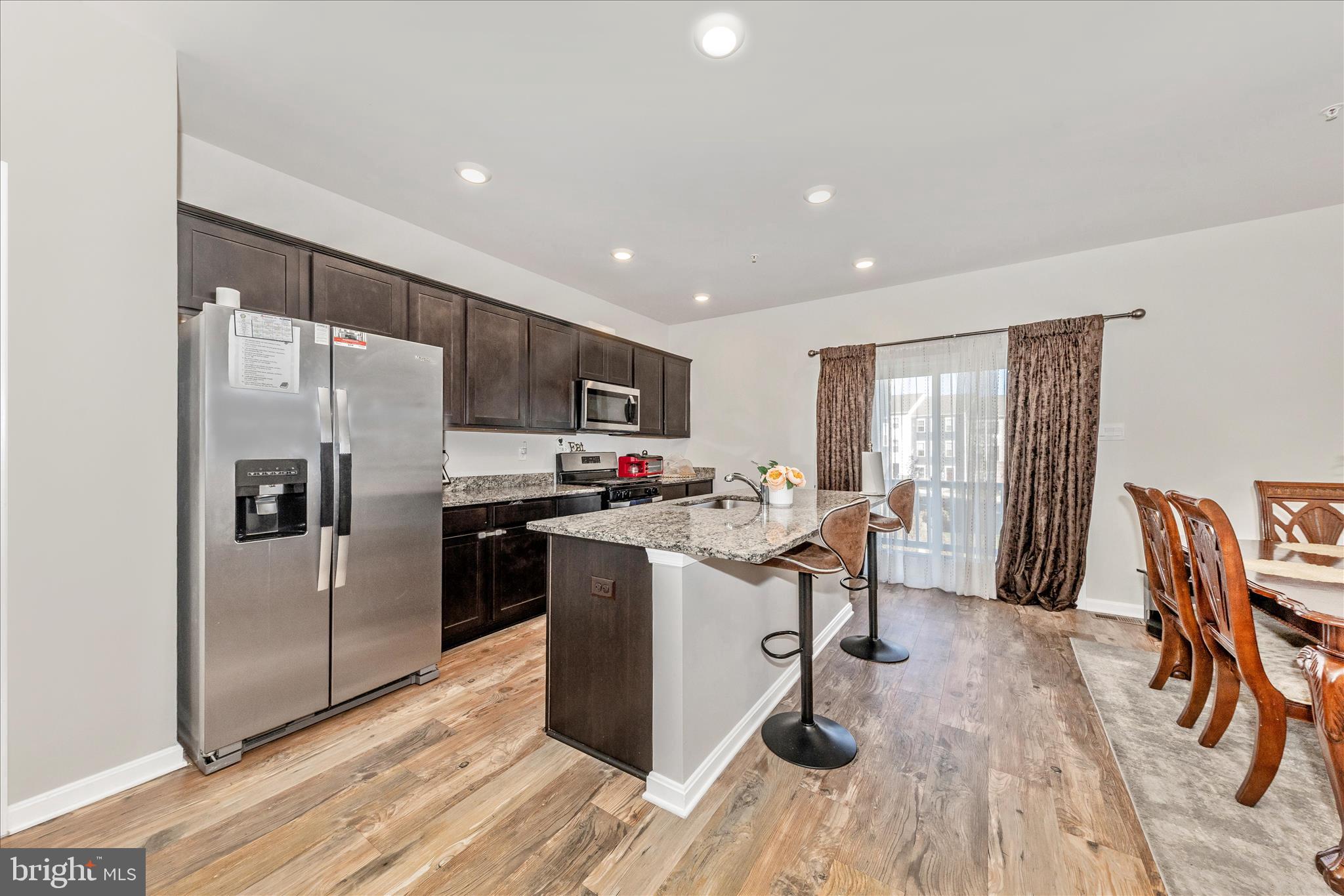 8648 Walter Martz Road Frederick, MD 21702 - Photo 10 of 50 a kitchen with kitchen island a counter top space a sink appliances and cabinets