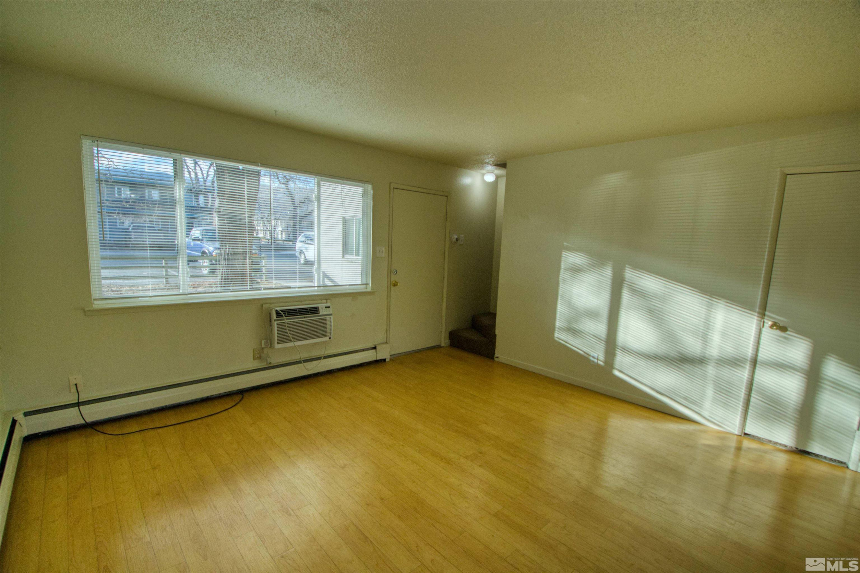 511 Country Village Drive, Unit 22 Carson City, NV 89701 - Photo 4 of 11 a view of an empty room with a window