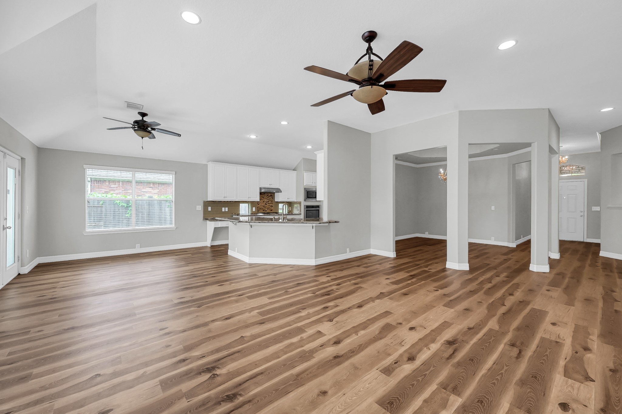 2906 Reynolds Creek Drive Spring, TX 77388 - Photo 11 of 38 a view of empty room with wooden floor and window