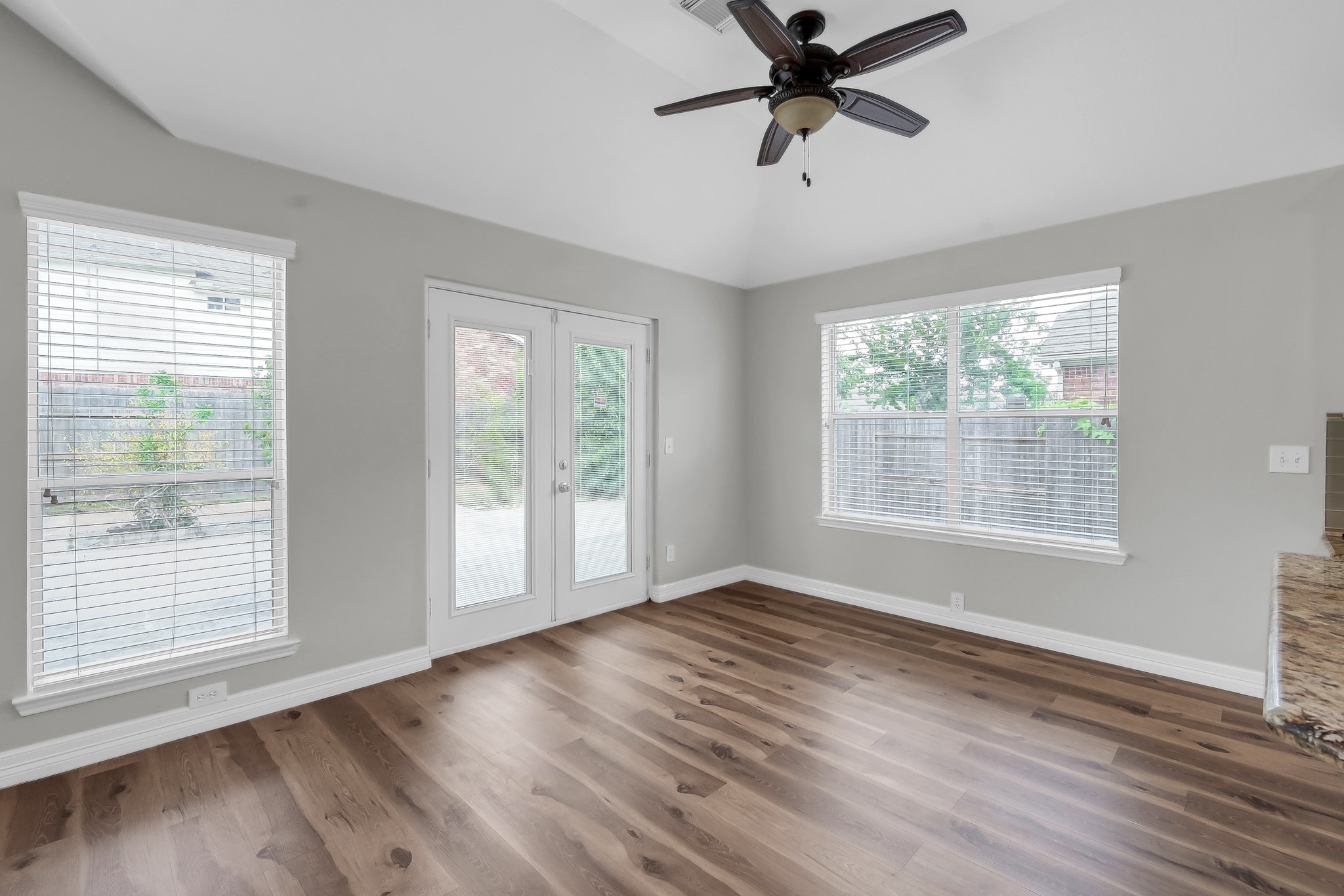 2906 Reynolds Creek Drive Spring, TX 77388 - Photo 13 of 38 a view of an empty room with wooden floor and a window