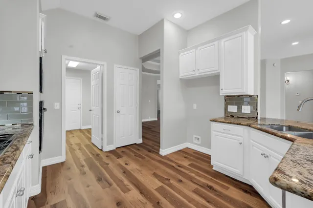 a bedroom with a large bed couch and a window