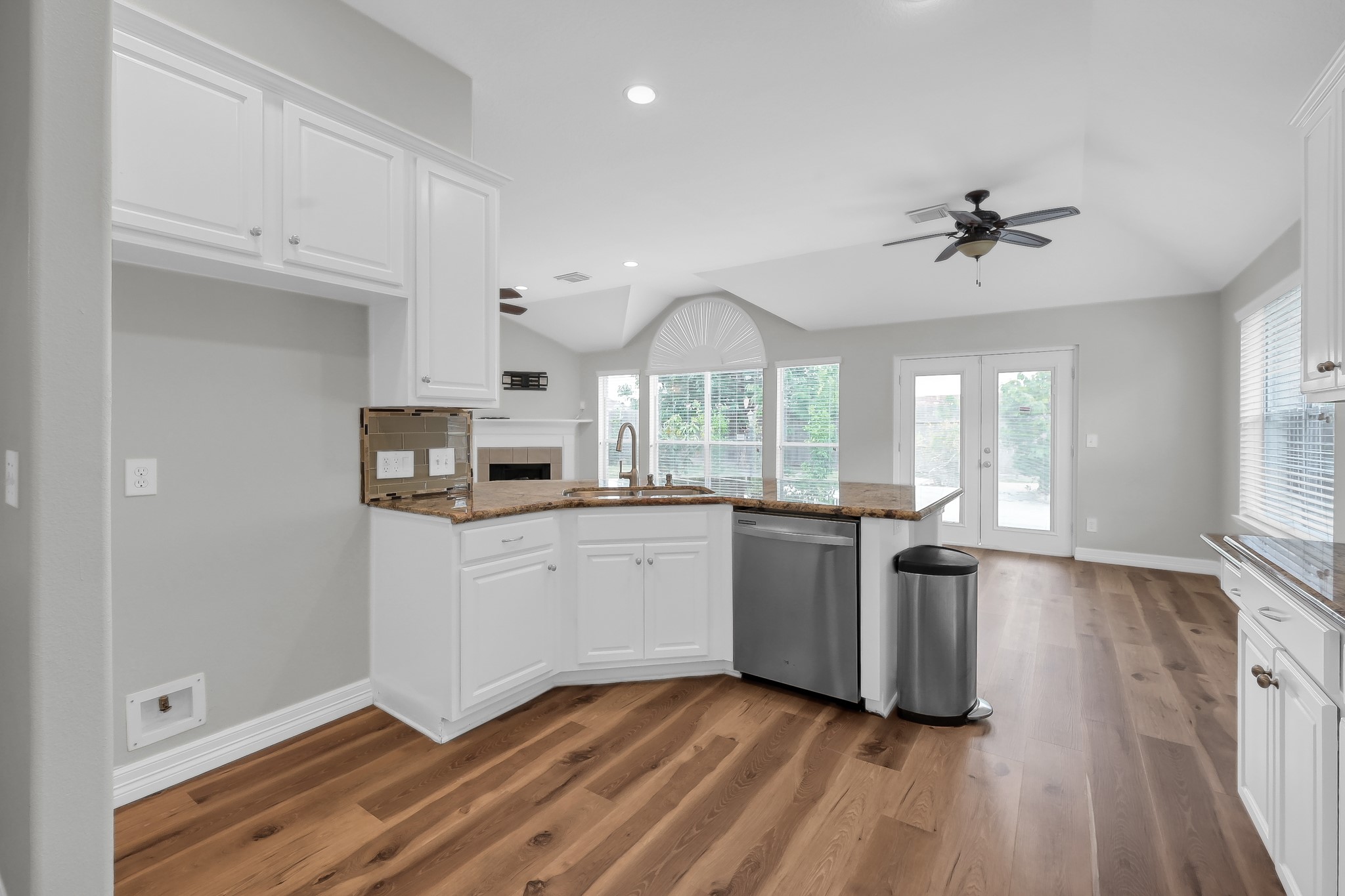 2906 Reynolds Creek Drive Spring, TX 77388 - Photo 18 of 38 a kitchen with stainless steel appliances granite countertop a stove a sink and a refrigerator