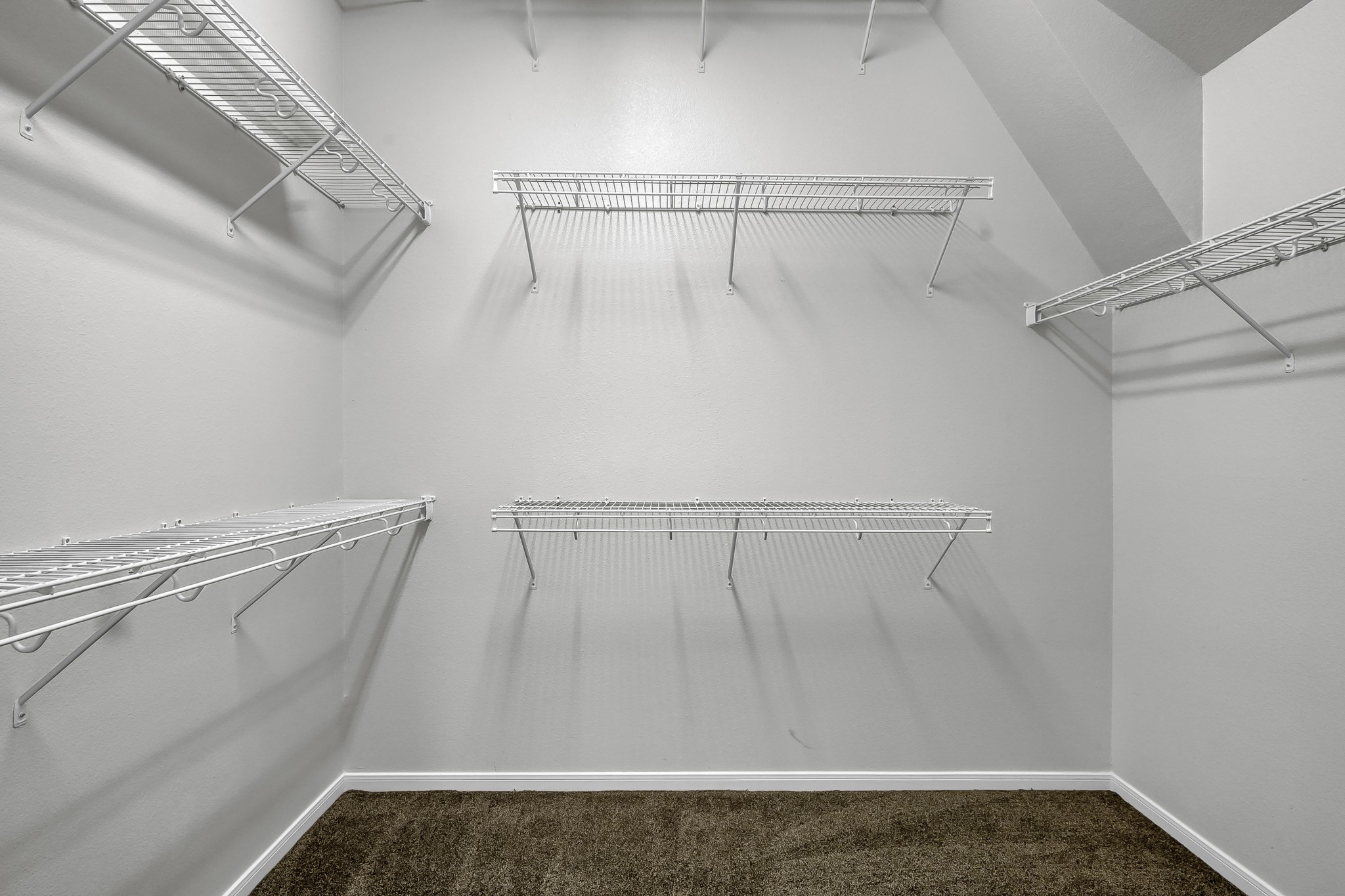 2906 Reynolds Creek Drive Spring, TX 77388 - Photo 25 of 38 a view of walk in closet with empty racks
