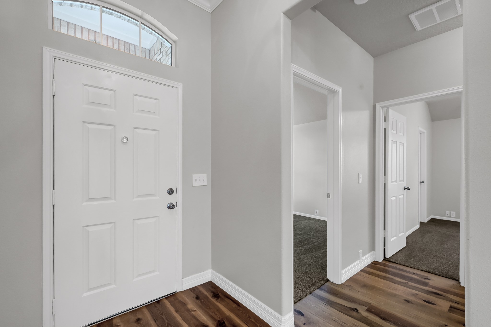 2906 Reynolds Creek Drive Spring, TX 77388 - Photo 26 of 38 a view of a hallway with wooden floor and staircase