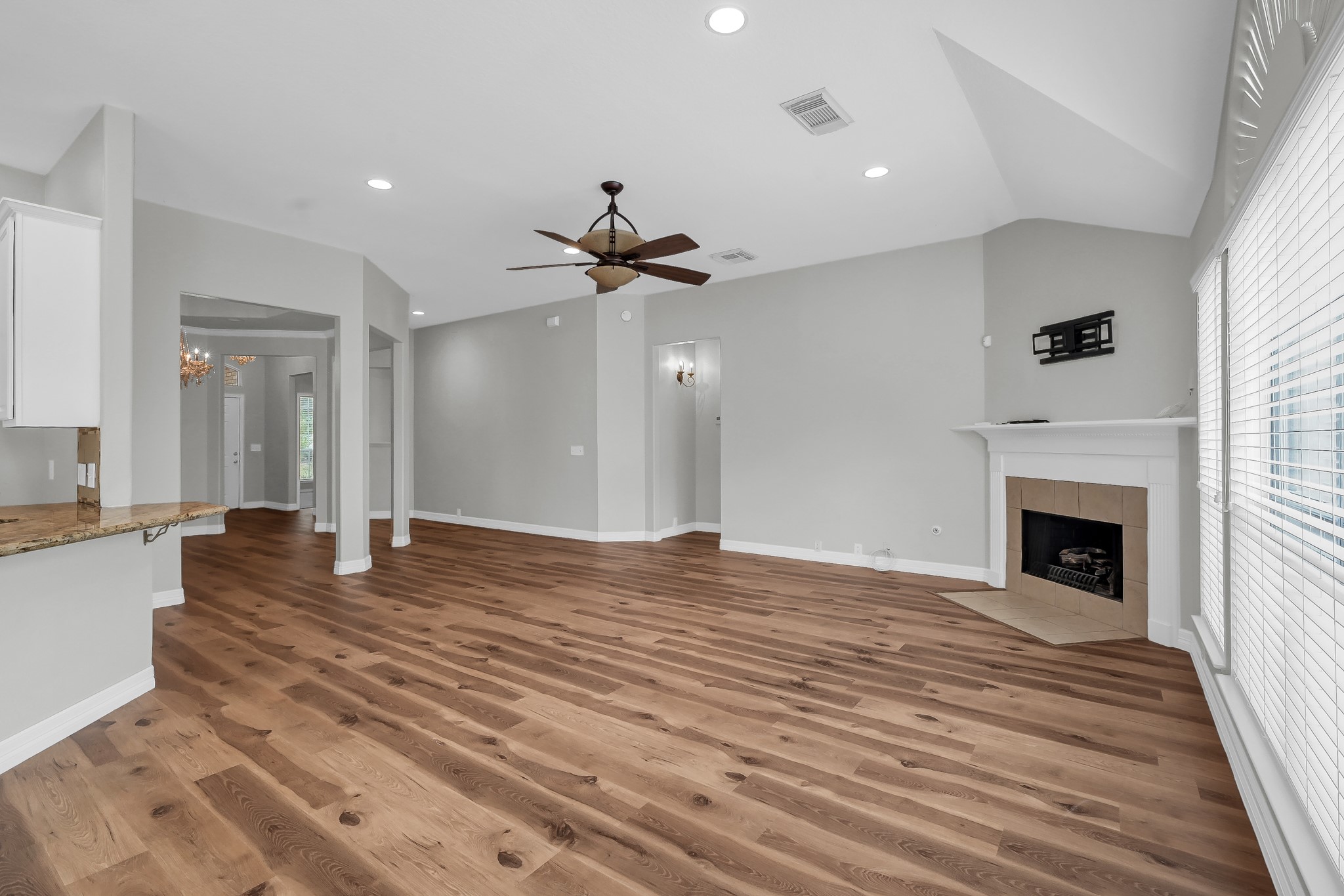 2906 Reynolds Creek Drive Spring, TX 77388 - Photo 9 of 38 a view of an empty room with wooden floor and a fireplace