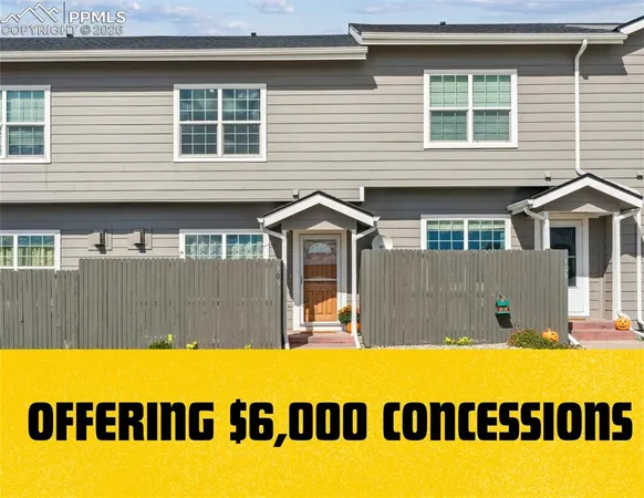 a view of swimming pool with house in the background
