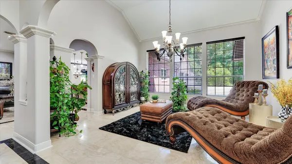 a bathroom with a granite countertop sink toilet a large mirror and shower