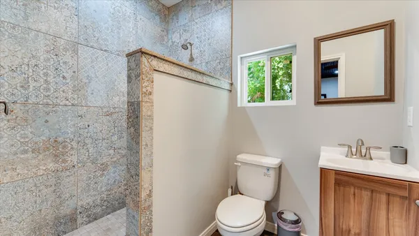 a view of a patio with table and chairs and wooden floor