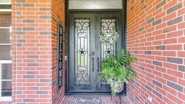 a view of green field with house in the background