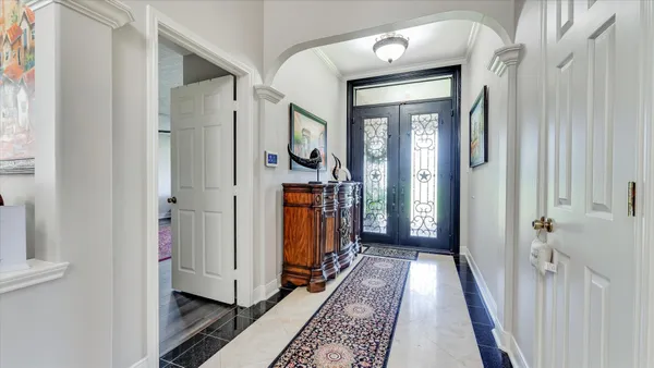 a view of hall way with furniture