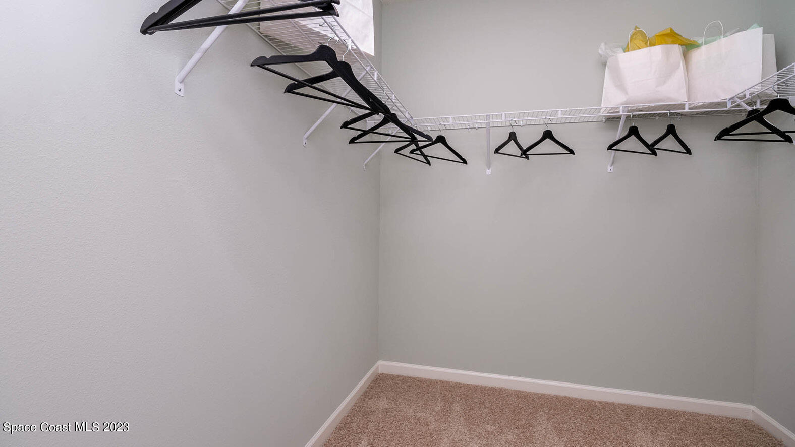 4954 Quartz Place Grant-Valkaria, FL 32949 - Photo 13 of 48 a view of small space with empty racks on the wall