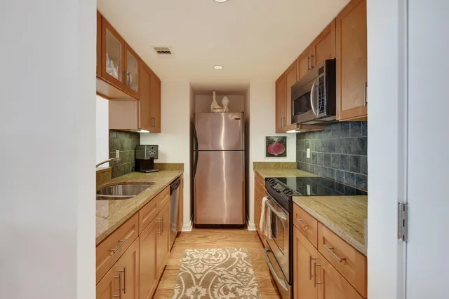 a kitchen with a stove and a microwave