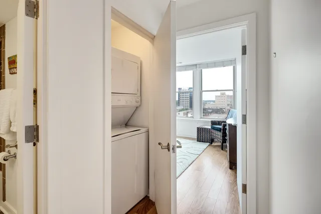 a view of staircase with white walls and a window