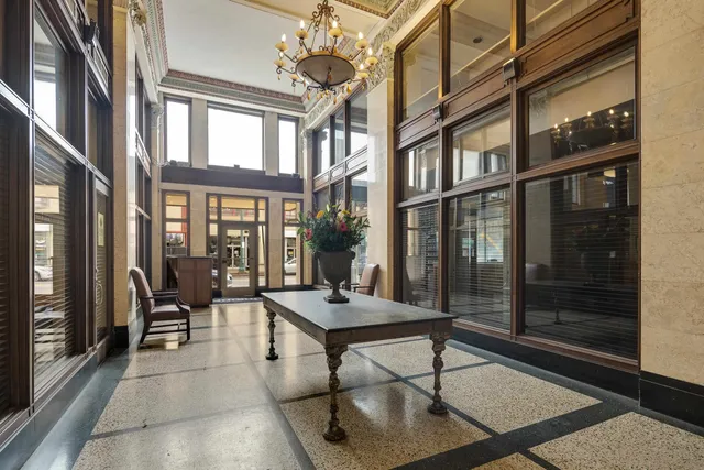 a view of patio with a table and chairs and wooden floor