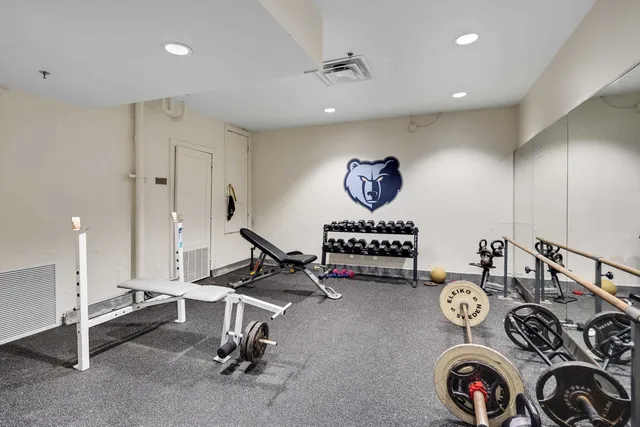 a large white kitchen with a large window