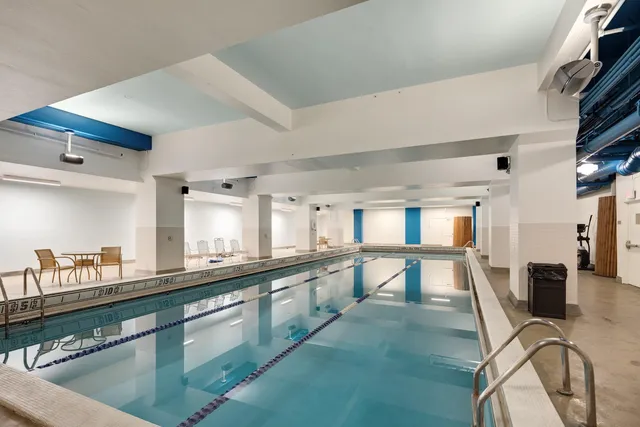 a view of swimming pool with seating space