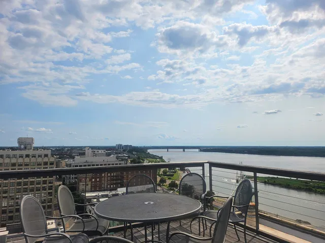 a view of hall way with furniture and a fireplace