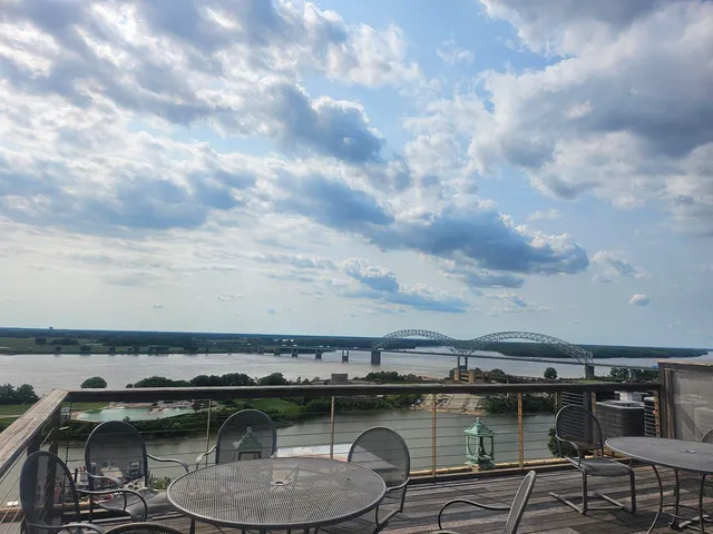 a view of a chairs and table in the balcony