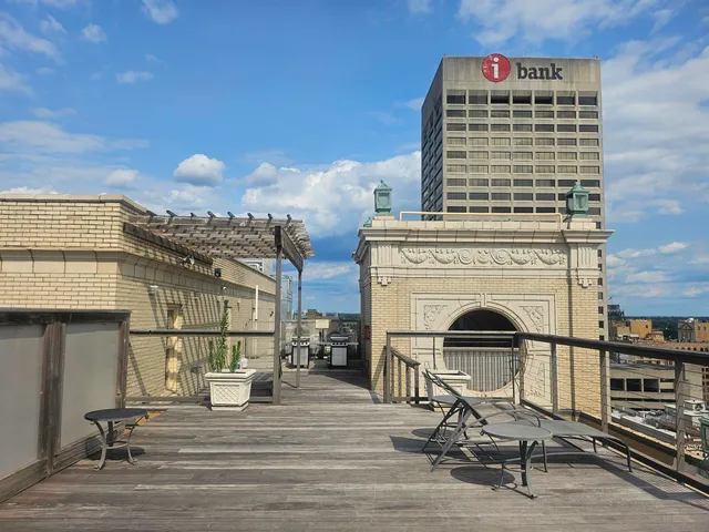 a view of a balcony next to a yard