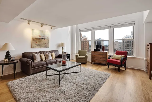 a living room with furniture and a large window