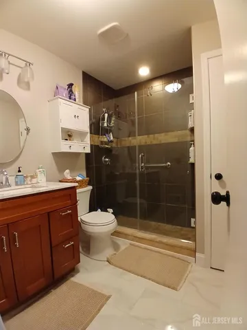 a view of a wooden bridge near a lake