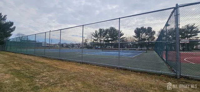 a view of a swimming pool with a yard