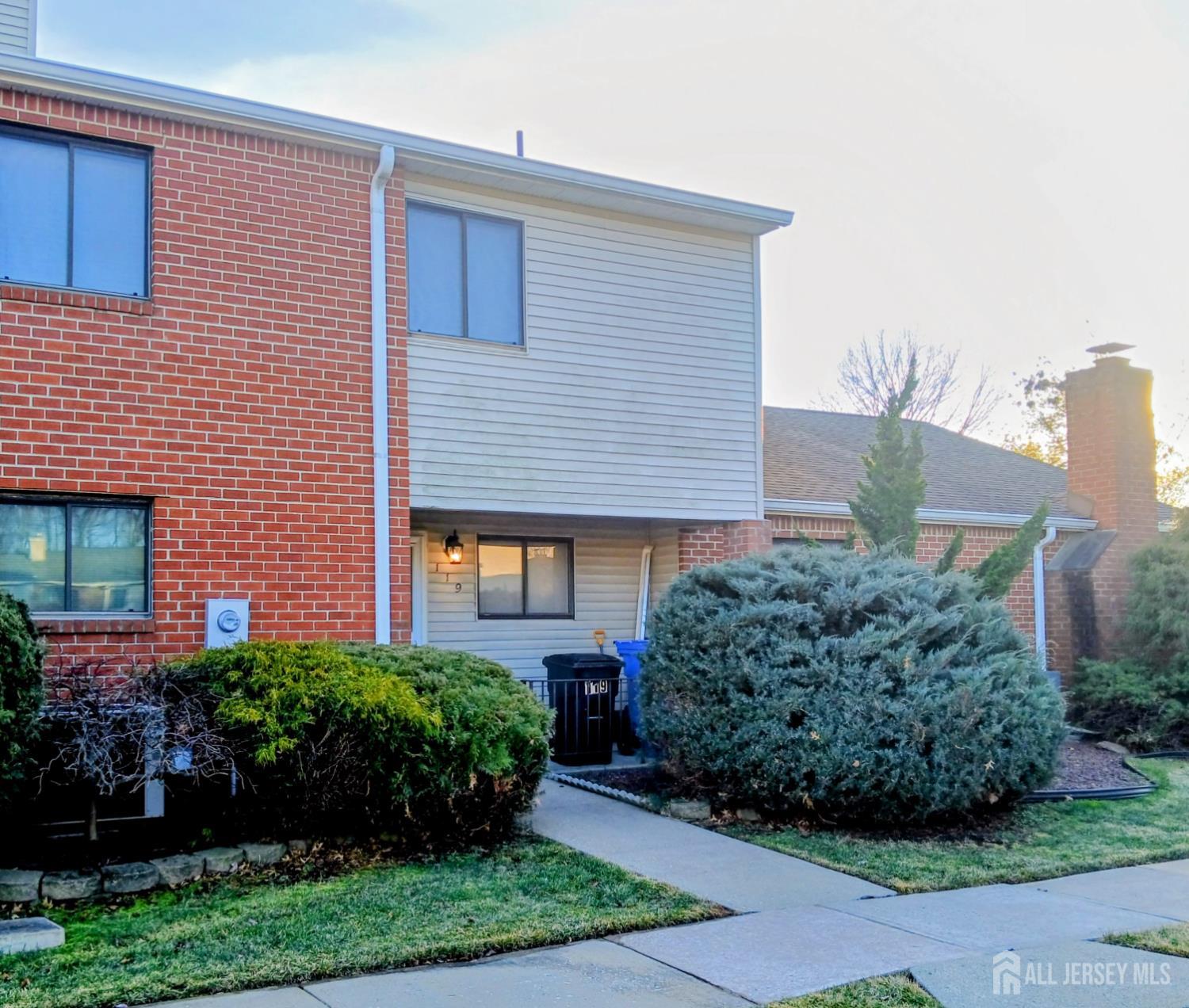 119 Nightingale Court Old Bridge, NJ 08857 - Photo 2 of 18 a front view of a house with a yard
