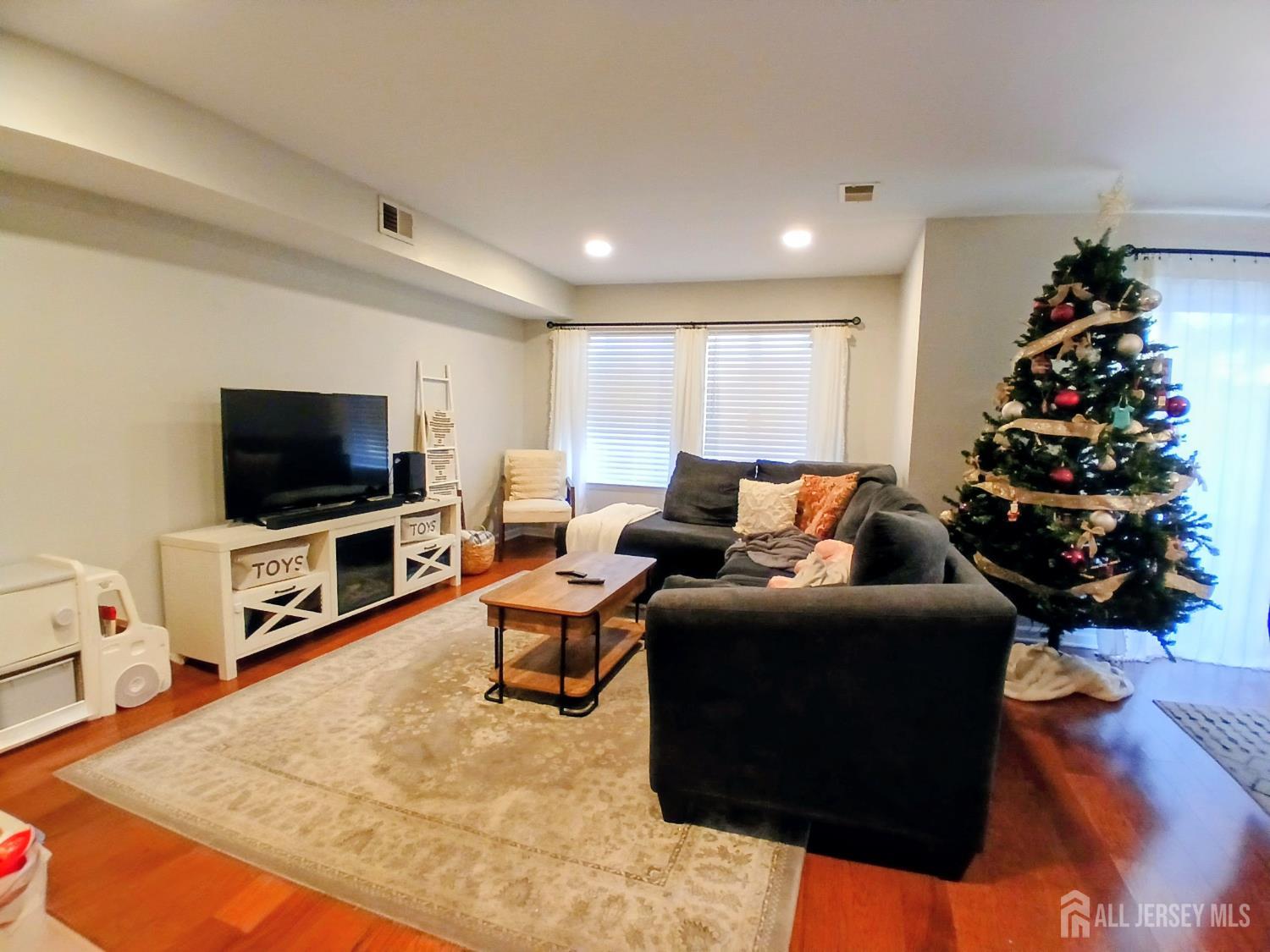 119 Nightingale Court Old Bridge, NJ 08857 - Photo 4 of 18 a living room with furniture and a flat screen tv