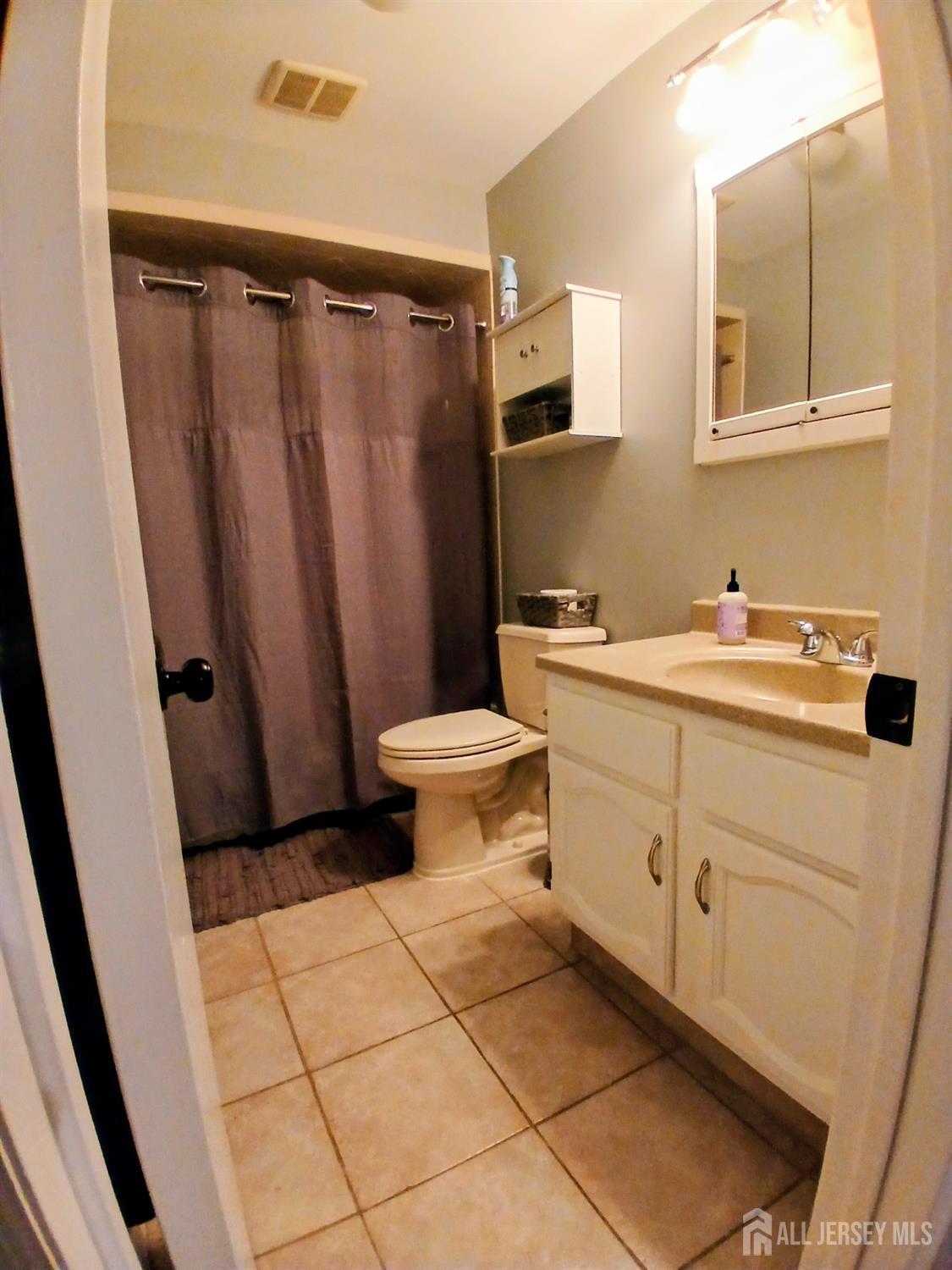 119 Nightingale Court Old Bridge, NJ 08857 - Photo 10 of 18 a bathroom with a sink toilet and shower
