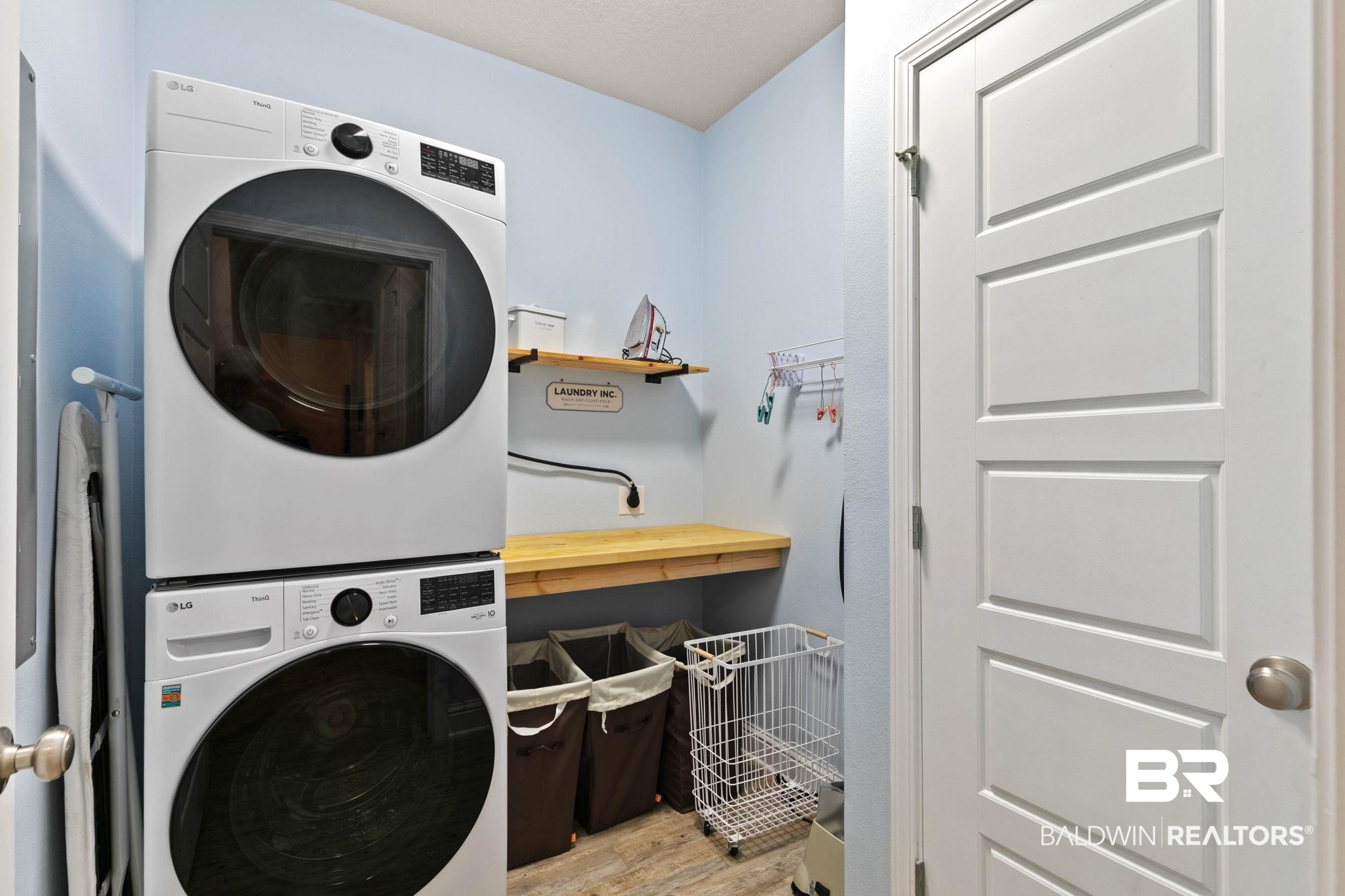 31350 Hoot Owl Road Daphne, AL 36527 - Photo 41 of 94 Laundry room with stacked washer / dryer and light wood-style floors