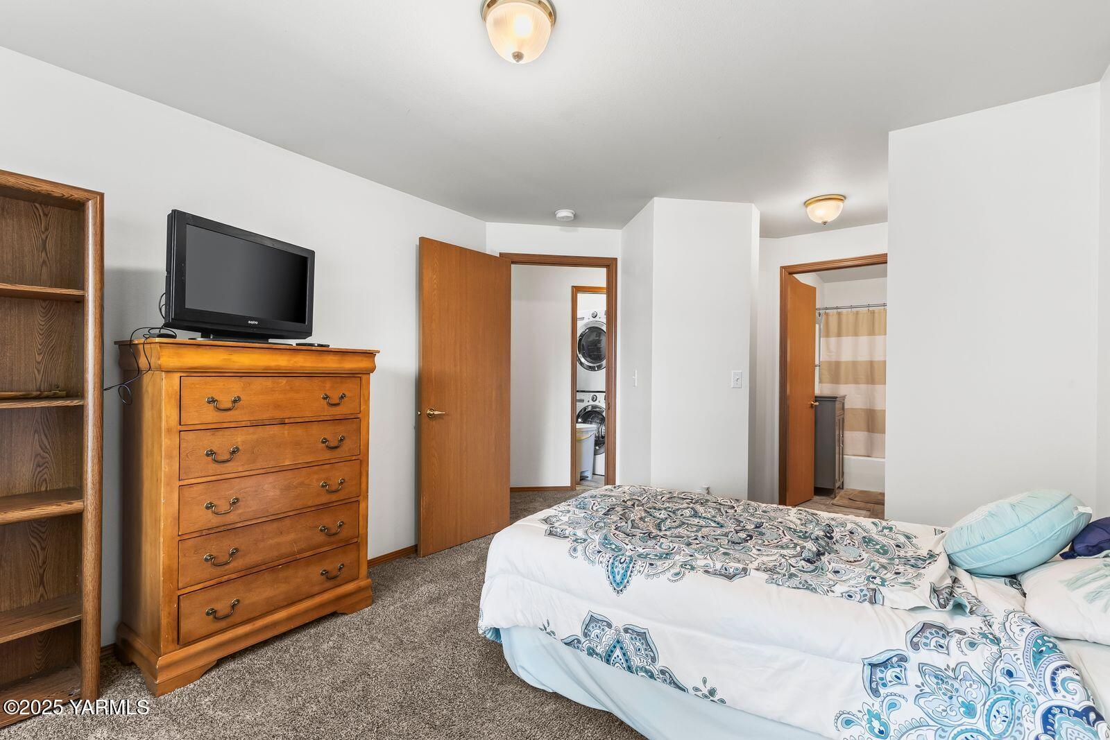 105 Peach Tree Lane, Unit 3 Yakima, WA 98908 - Photo 13 of 21 a bedroom with a bed and wooden floor