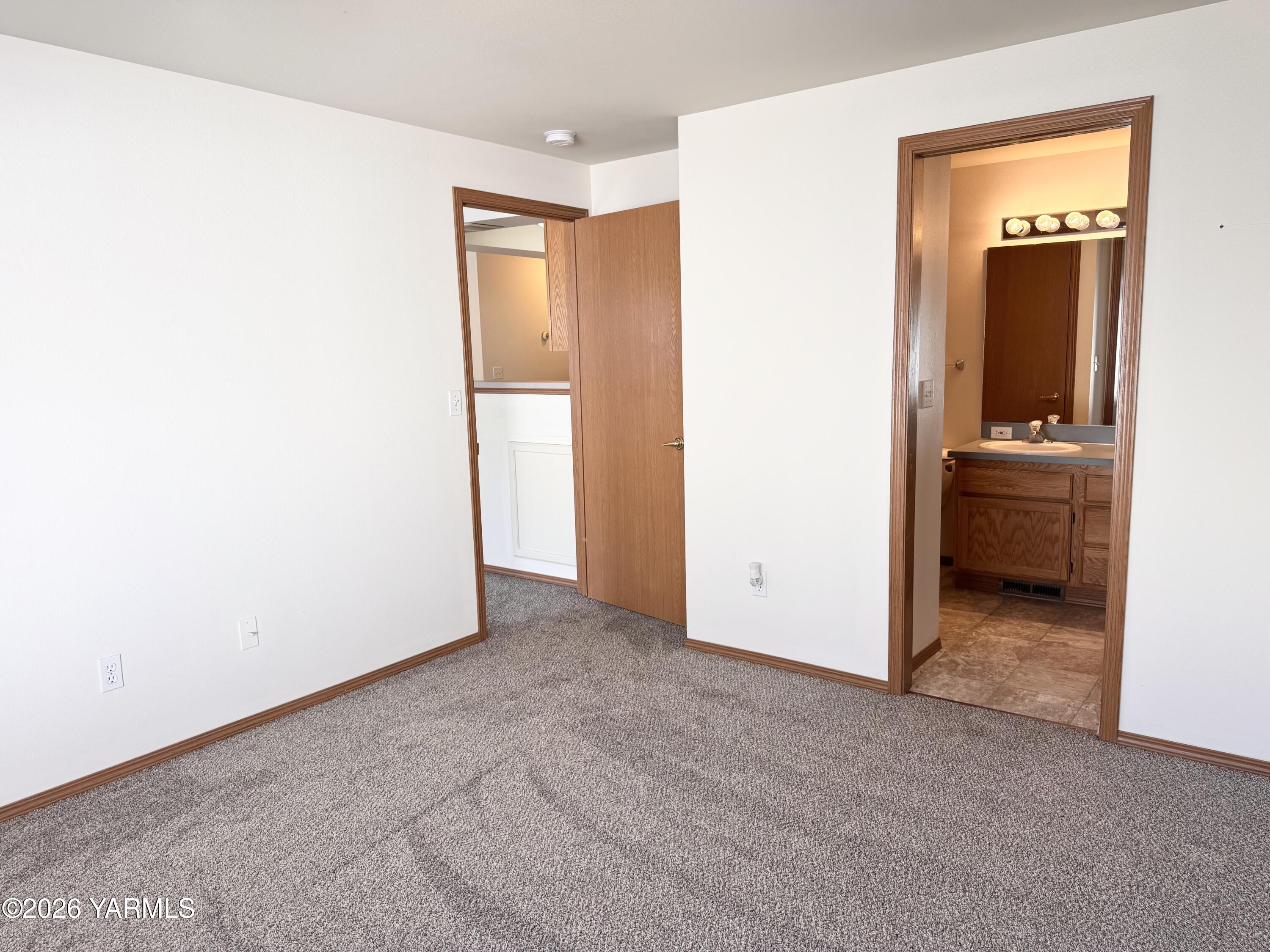 105 Peach Tree Lane, Unit 3 Yakima, WA 98908 - Photo 9 of 21 an empty room with closet and a bathroom