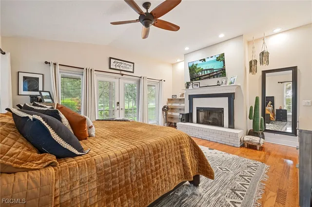 a bedroom with a bed and a fireplace