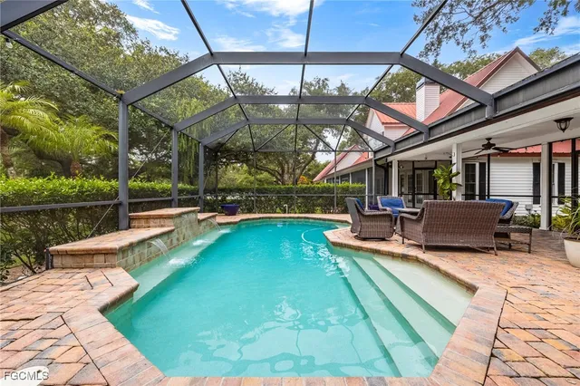 a view of a swimming pool with a patio
