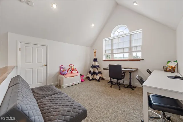 a bedroom with furniture and a window