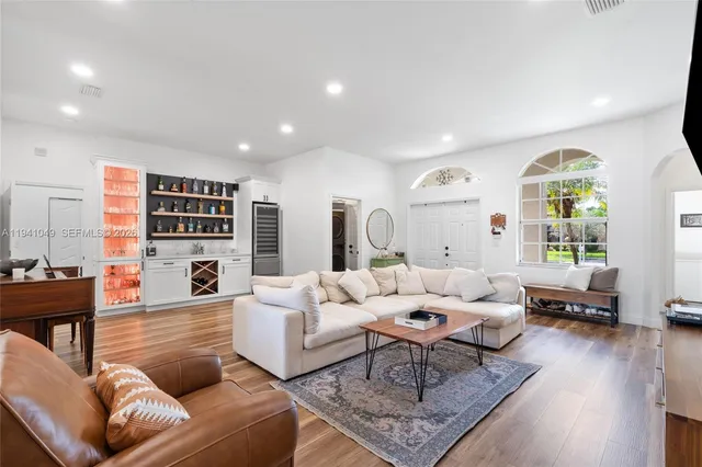 a living room with furniture and a large window