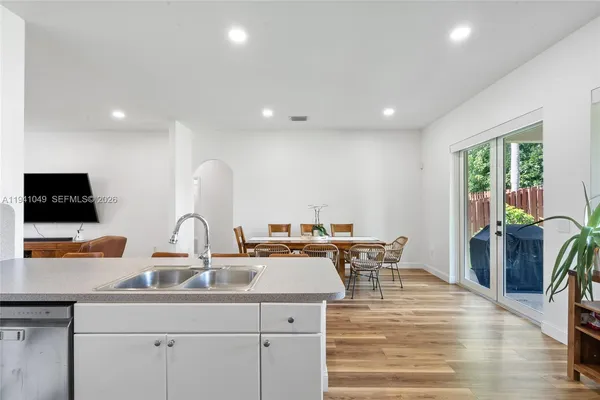a kitchen with stainless steel appliances a refrigerator and a stove top oven