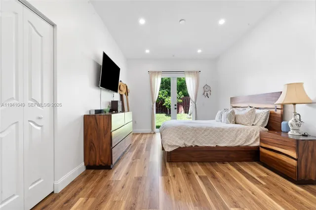 a bathroom with a tub sink shower and mirror