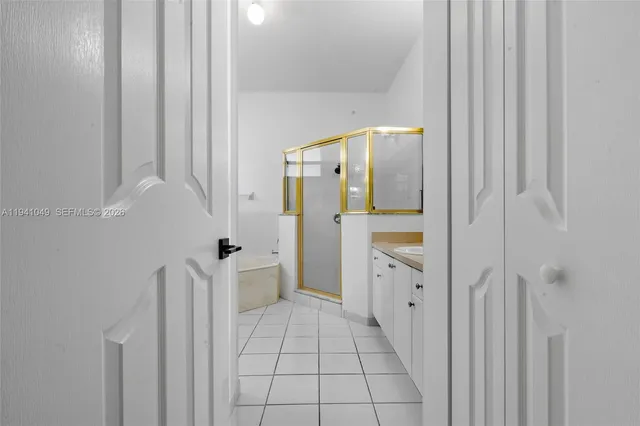 a white toilet sitting next to a white sink