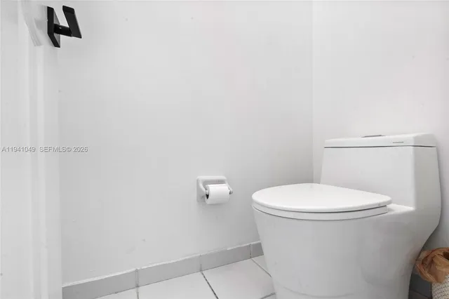 a view of a bathroom from the hallway