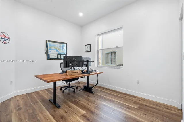 a view of a backyard with a table and chairs