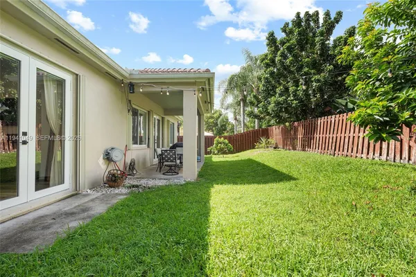 a backyard of a house with lots of green space